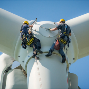 An image of two engineers working on a wind turbine for our article on how to become a health and safety engineer