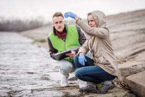 environmental scientists work in the field and in the lab